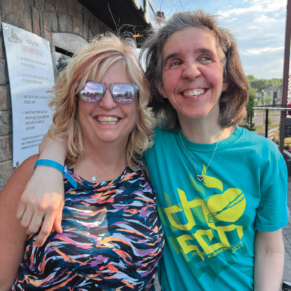  Two woman posing and smiling